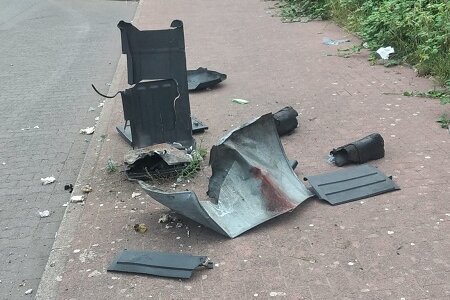 Foto: Bürgersteig mit gesprechter Mülltonne